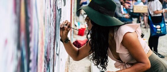 photo-of-woman-painting-on-wall-1340502.jpg